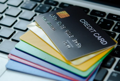 Shopper swiping a credit card at a store during the festive season in India.