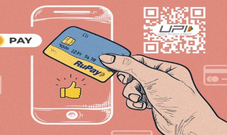 Customer making a UPI payment using a RuPay credit card on mobile app.