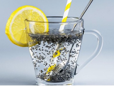 Bowl of chia seeds soaked in water with lemon and mint