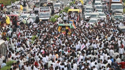 Farmers sitting on Nagpur highway during protest for loan waivers as police monitor the situation