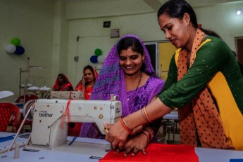 Women in India participating in self-employment training under Mahila Rozgar Yojana and receiving financial support under Mai-Behin Scheme