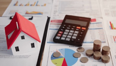 Homebuyer reviewing property papers with tax saving documents under Section 54 of Income Tax Act