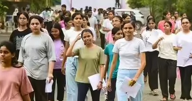 Medical students reviewing NExT exam postponement announcement on notice board