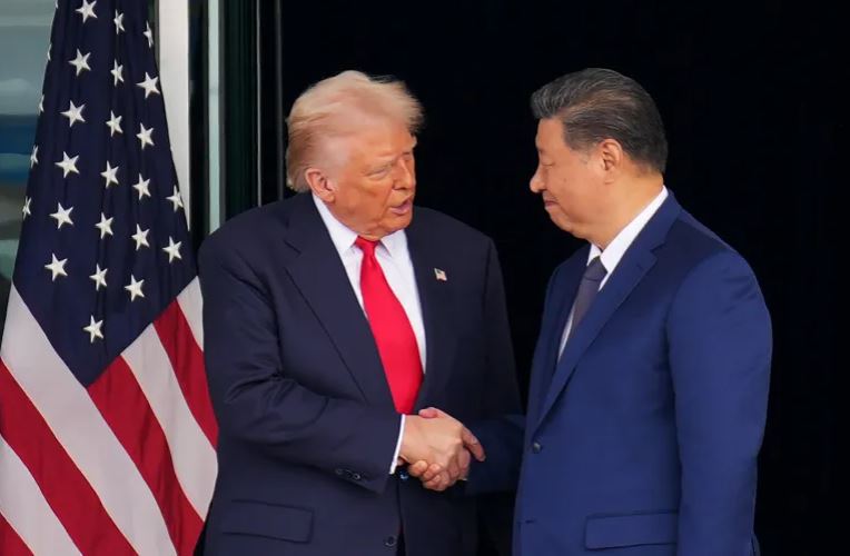 US President Donald Trump and Chinese President Xi Jinping shake hands after announcing tariff cuts and trade deals in 2025.