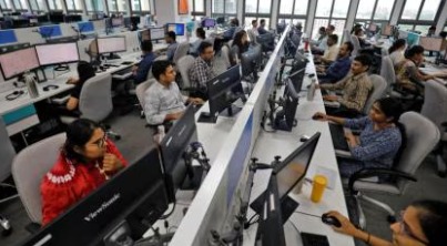 Indian professionals working in manufacturing and services sectors as October PMI shows slight moderation in growth