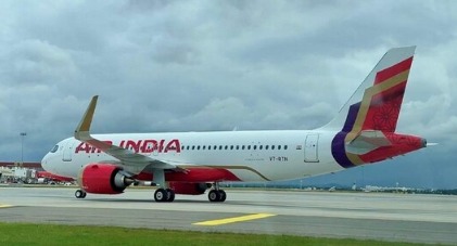 Air India aircraft on runway as Tata Sons and Singapore Airlines consider $1 billion funding support.