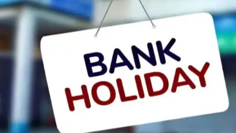 Indian bank branch with closed sign indicating bank holiday