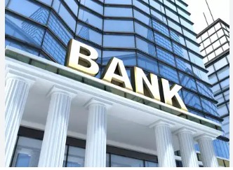 Bank officer reviewing personal loan applications as new credit norms tighten