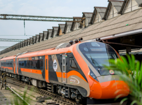 Varanasi to Khajuraho Vande Bharat Express train at a railway platform.