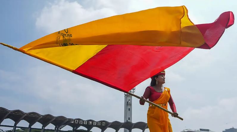 People celebrating Kannada Rajyotsava 2025 in Bengaluru with flags and cultural performances