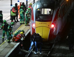 British Transport Police officers investigating a train carriage after a stabbing incident in the UK