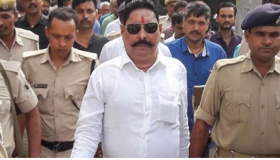 Anant Singh being escorted by police officers after arrest, representing political controversy before Bihar elections 2025