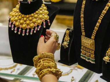 Stacks of gold jewellery pledged in bank vaults representing rising gold-loan portfolios in India