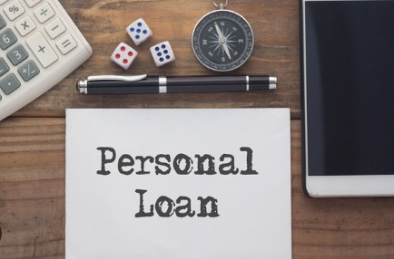 A person comparing personal loan offers on a laptop, representing getting the best deal with Vizzve Finance