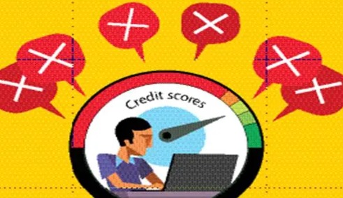 Person checking credit score report on laptop after missing a personal loan EMI payment