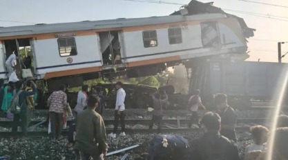 Damaged train coaches and rescue workers at the site of a train collision in Chhattisgarh.