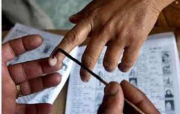 Election officials preparing ballot boxes and EVMs for Maharashtra municipal and local body elections scheduled on December 2, 2025.