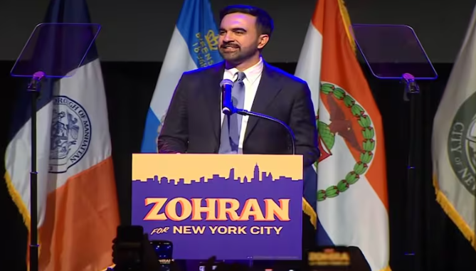 Zohran Mamdani speaking at a public event discussing election strategy