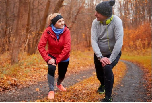 Person walking briskly outdoors to burn 300–400 calories per hour at 65 kg body weight