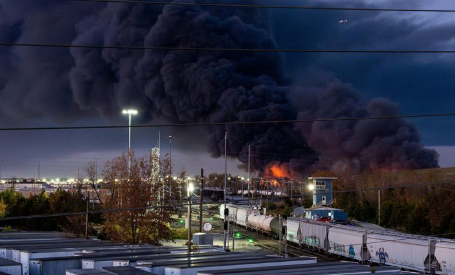 Emergency response teams near cargo plane crash site close to Kentucky airport