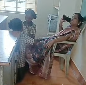 Andhra Pradesh school building with educational staff outside, representing school environment and administration.
