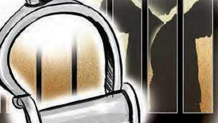 SIT officials inspecting seized liquor cartons at a storage warehouse in Goa.