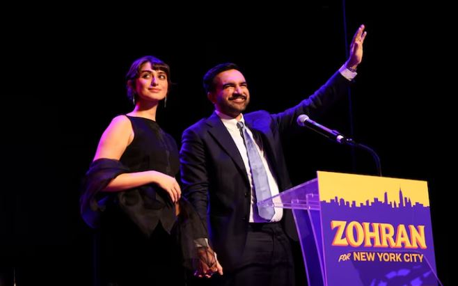 “Rama Duwaji on stage with Zohran Mamdani celebrating primary win”
