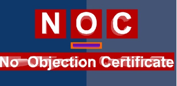 Sample No Objection Certificate document with official stamp and signature on a wooden desk.