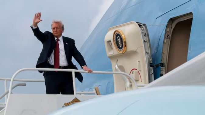 Donald Trump speaking at the America Business Forum, with a background graphic of fighter jets over Indo-Pakistani border-map