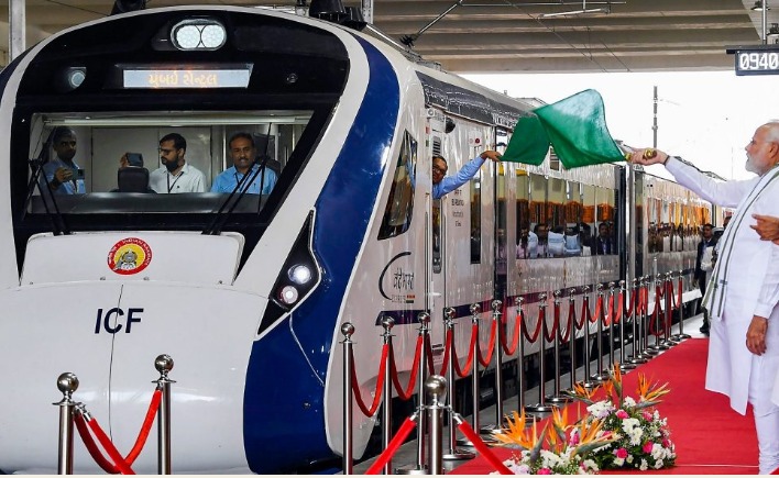 Vande Bharat Express train with PM Modi flagging off the launch, showcasing modern rail infrastructure in India