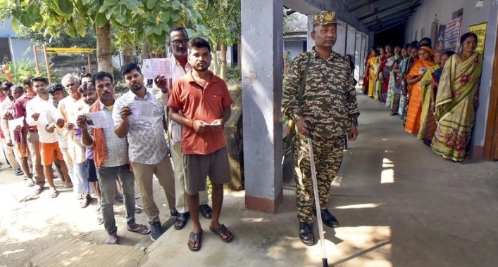 Voters queueing outside a polling booth in Bihar during the 2025 Assembly Elections Phase 1
