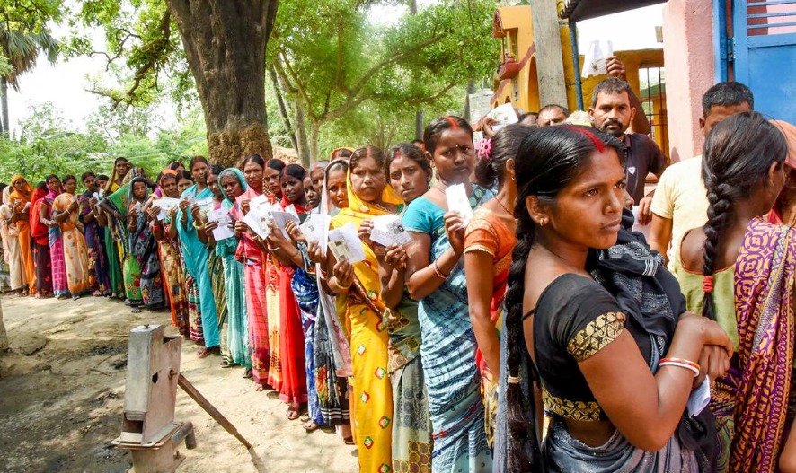 Voters standing in line outside a polling booth in Bihar during Phase 1 of the 2025 Assembly Elections.