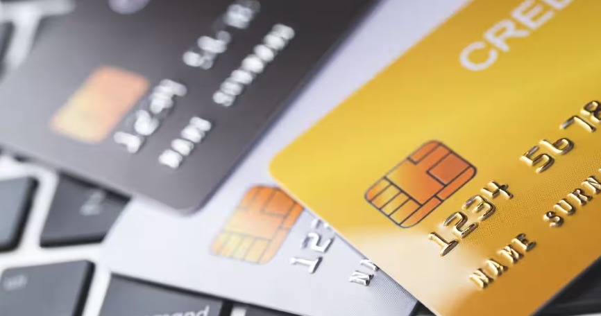 Customer comparing multiple credit cards and checking credit score on mobile