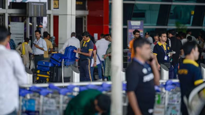 Passengers waiting at Delhi Airport amid massive flight delays caused by Air Traffic Control glitch