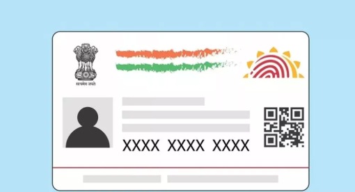 Illustration of a masked Aadhaar card showing only last four digits of the Aadhaar number for secure identity verification.