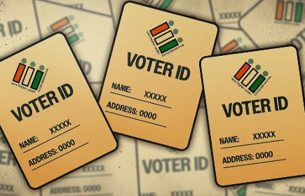 Haryana voter showing her voter ID with photo, highlighting a mismatch between the photo and the name on the card.