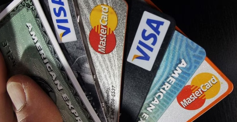 Customer checking monthly credit card bill showing minimum due amount