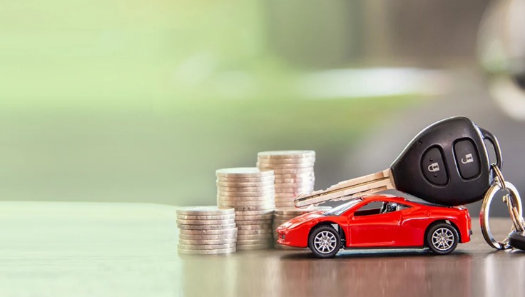 A customer signing used car loan documents at a dealership, symbolizing India’s growing pre-owned vehicle finance market.