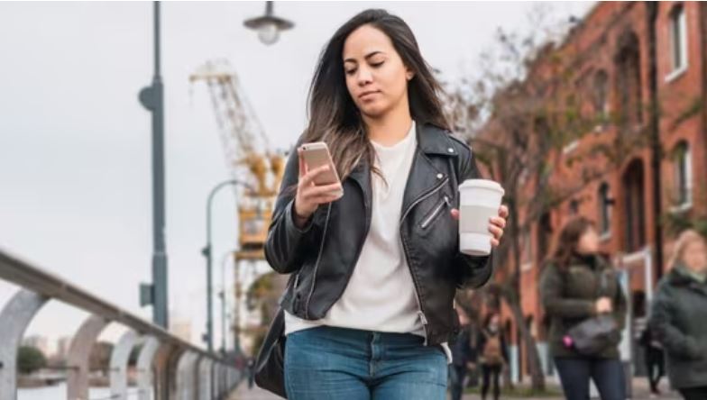 Person walking outdoors after a meal to support heart health