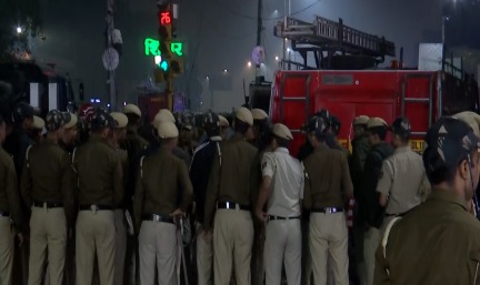Security personnel conduct investigation near Red Fort in Delhi after explosion; multi-state probe launched.
