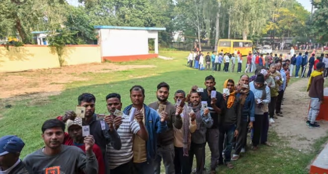 People queue at polling booths in Bihar as election officials prepare for the final phase of voting in the 2025 Assembly elections.