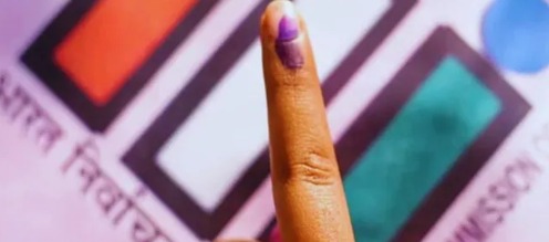 Election officials counting votes during Bihar Assembly Elections 2025 at a polling center.