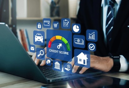 Person reviewing credit score on smartphone with financial documents on desk.