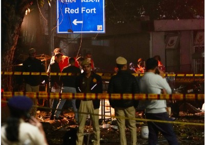 Delhi Police officials examining evidence near Red Fort after blast investigation confirms bomber’s identity.