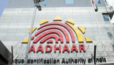 UIDAI office building with Aadhaar logo representing updates on deceased Aadhaar card holders.