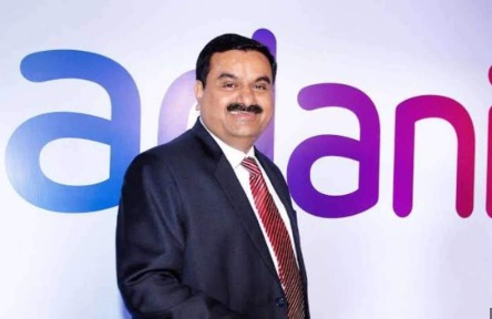 Karan Adani announcing major investment plans for Andhra Pradesh by the Adani Group.