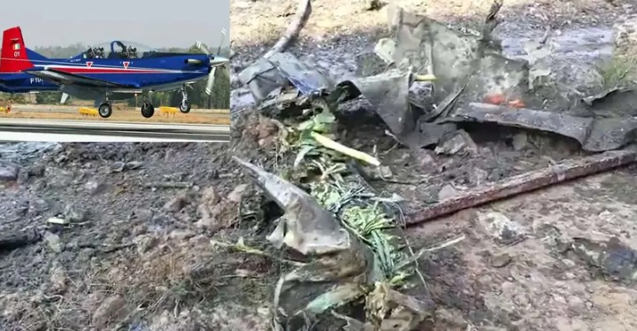 IAF personnel inspecting the site of a trainer aircraft crash near Chennai.