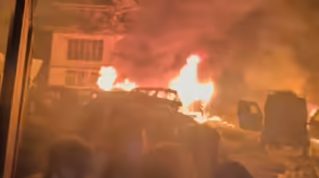 “Destruction after J&K police station blast showing debris and damaged building”