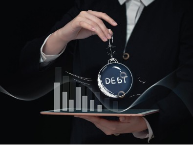 Person consolidating multiple credit card bills into one personal loan EMI.