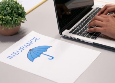 Borrower reviewing loan insurance options while applying for a bank loan.